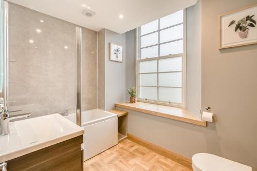 a bathroom with a sink and a tub and a toilet at 3 Bed in Dunning oc-t35973 in Dunning