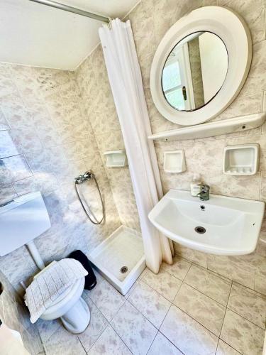 a bathroom with a sink and a mirror at Anna in Megali Ammos