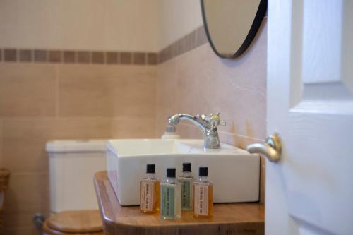 a bathroom with a sink and a counter with toothpaste at Villa Morris in Nydri