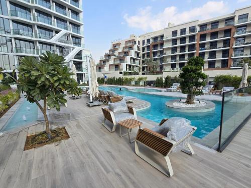 a view of a swimming pool in a building at Arjan Luxury Studio Pool View Near Miracle Garden in Dubai