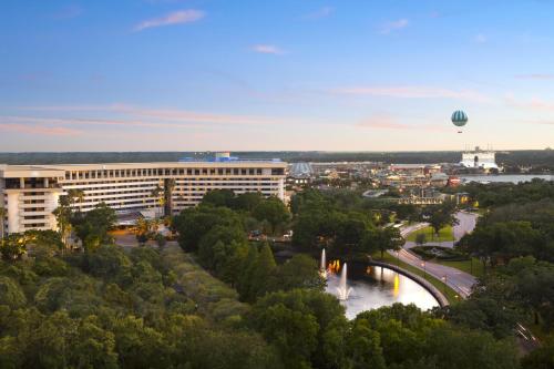 a view of a building and a river with a hot air balloon at Hilton Orlando Lake Buena Vista - Disney Springs™ Area in Orlando