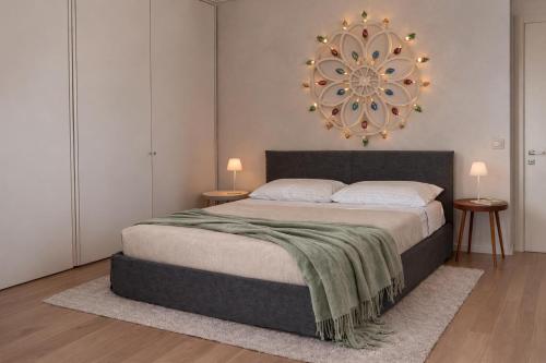 a bedroom with a large bed and two night stands at Da Lorenzo Luxury Apartment in Bologna