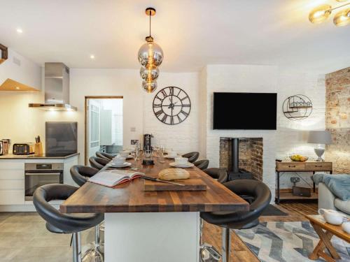 a kitchen and living room with a table and chairs at 4 Bed in Hastings oc-85916 in Hastings