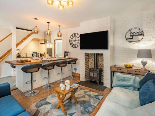 a living room with a bar and a fireplace at 4 Bed in Hastings oc-85916 in Hastings