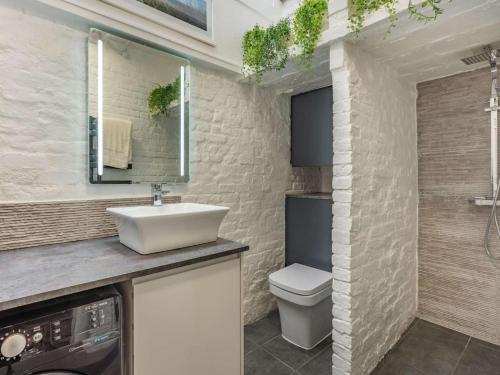 a bathroom with a sink and a toilet at 4 Bed in Hastings oc-85916 in Hastings