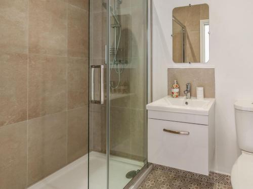 a bathroom with a shower and a sink and a toilet at 5 Bed in Margate oc-86551 in Margate