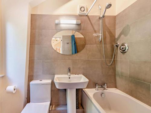 a bathroom with a sink and a toilet and a mirror at 1 Bed in Tunbridge Wells oc-79180 in Wadhurst