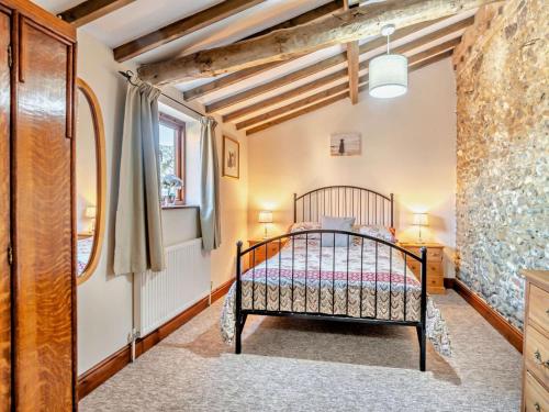 a bedroom with a bed and a window at 3 Bed in Kings Lynn oc-75673 in Tattersett
