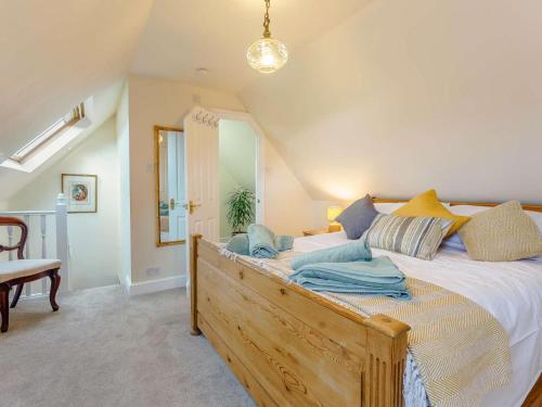 a bedroom with a large bed in a room at 4 Bed in Ashford oc-86647 in Ashford