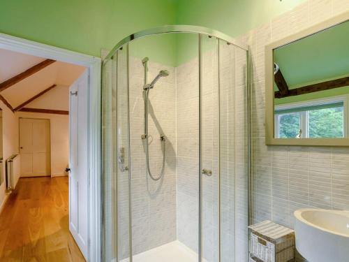 a bathroom with a shower and a sink at 5 Bed in Dereham oc-89542 in Swanton Morley