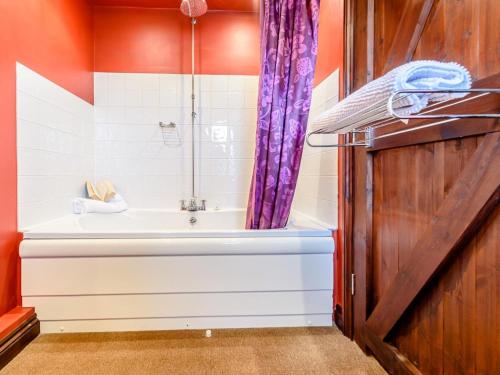 a bathroom with a tub and a shower at 2 Bed in Bedford oc-79558 in Wyboston