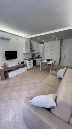 a large living room with a couch and a table at Casa Memi in Chioggia