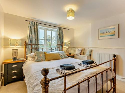 a bedroom with a bed with two pillows on it at 3 Bed in Norwich oc-85528 in Thurgarton
