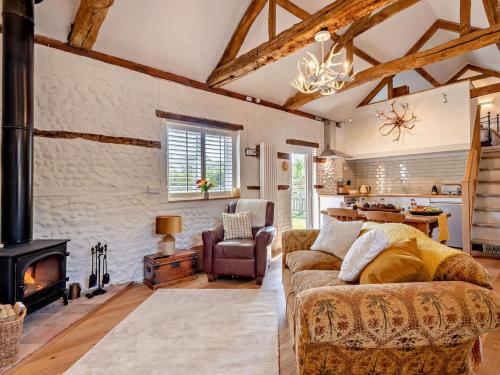 a living room with a couch and a fireplace at 1 Bed in Kings Lynn oc-32202 in Beeston