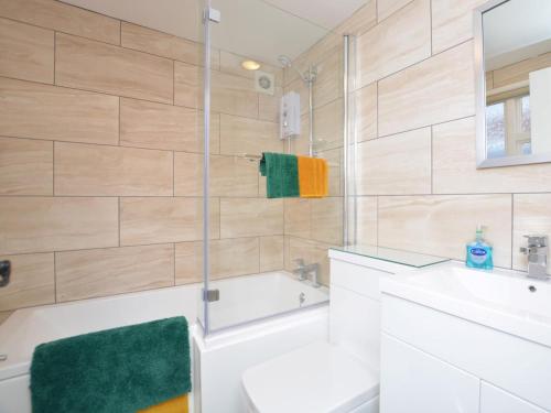a bathroom with a tub and a sink and a toilet at 2 Bed in Boston oc-90123 in Boston