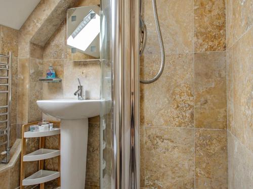 a bathroom with a sink and a shower at 2 Bed in Holt oc-ncc39 in Cley next the Sea