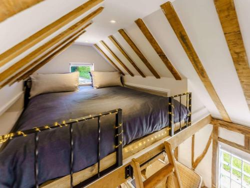 a bedroom with a bed in a attic at 1 Bed in Ashford oc-82527 in Biddenden