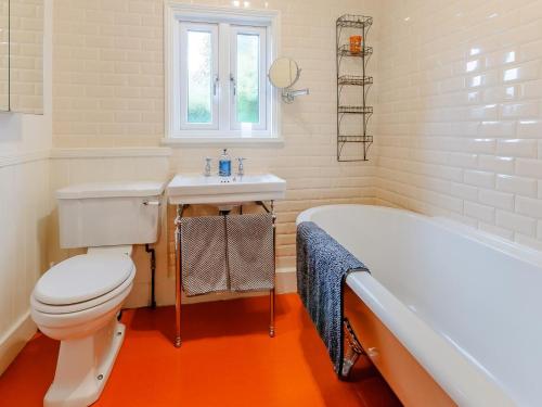 a bathroom with a toilet and a sink and a tub at 3 Bed in Whitstable oc-84042 in Whitstable