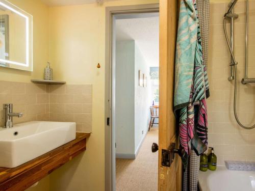 a bathroom with a sink and a bath tub at 2 Bed in Lowestoft oc-88109 in Lowestoft