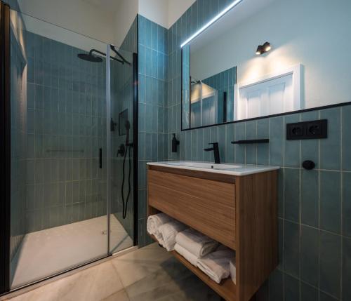 a bathroom with a sink and a shower at Casa Tomás Boutique Hotel in Seville
