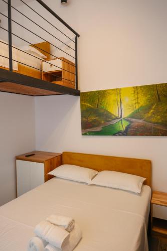 a bedroom with a bed with two towels on it at Hotel Adria 2 Shengjin in Shëngjin