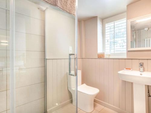 a bathroom with a toilet and a sink at 3 Bed in Kings Lynn oc-88223 in Beeston