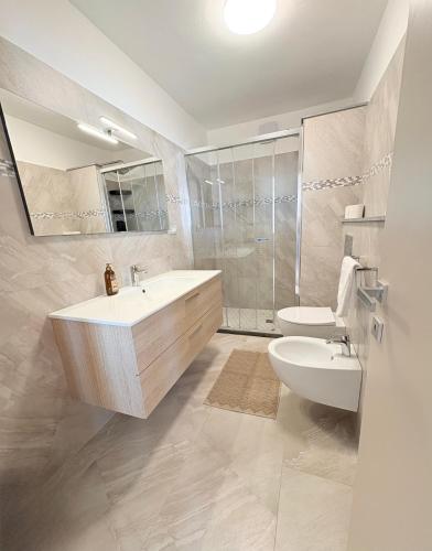 a bathroom with a sink and a toilet at Sunrise apartament in Monterosso al Mare