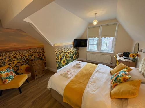a bedroom with a large bed and a window at All Seasons Bed & Breakfast - Adults Only in Weston-super-Mare