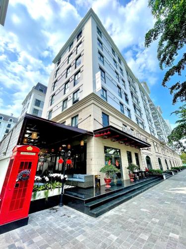 a red phone booth in front of a building at Grand Bay Hotel - Grand World Phu Quoc in Phú Quốc