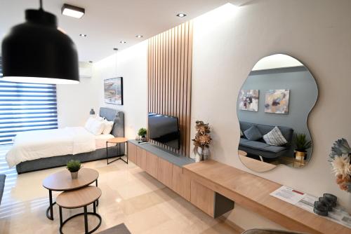 a bedroom with a bed and a mirror at Efanton 3 in Larisa