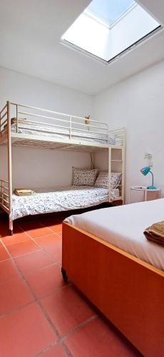a bedroom with two bunk beds in a room at Bean House in Vila Nova de Cerveira