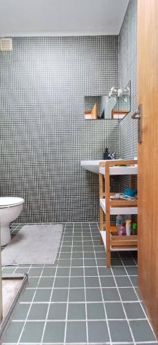 a bathroom with a sink and a toilet at Bean House in Vila Nova de Cerveira