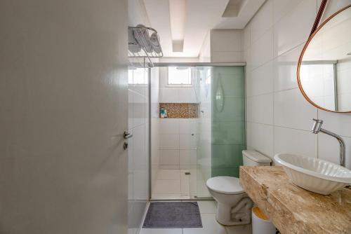a bathroom with a sink and a toilet and a shower at Apartamento Canto da Chaco | by Aquarela Stays in Belém