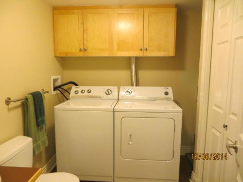 a washer and dryer in a small bathroom at Kaslo Bay Condominium in Kaslo