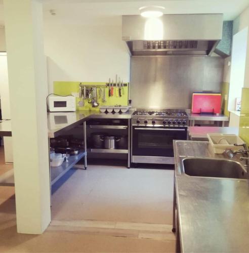 a kitchen with a stove and a sink at Secluded Seven Room House in Okehampton