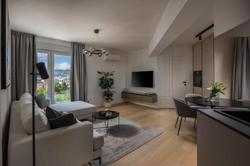 a living room with a couch and a table at Iman Apartments in Zagreb