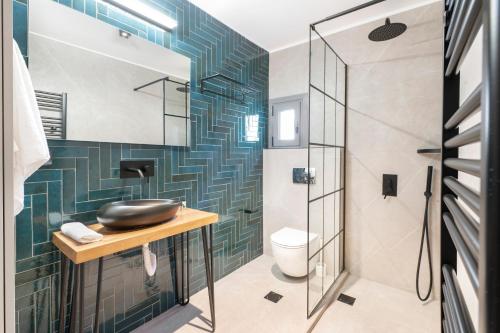 a bathroom with a sink and a shower at Azure Harmony Pool Villa by SEM in Áyios Spirídhon