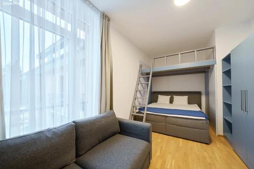 a living room with a couch and a bunk bed at Dolce Vita Harrachov in Harrachov