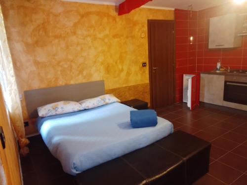 a bedroom with a large bed with pillows on it at Al vico art in Crosia