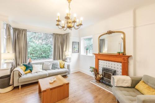 a living room with a couch and a fireplace at Host & Stay - Combpyne in Compton
