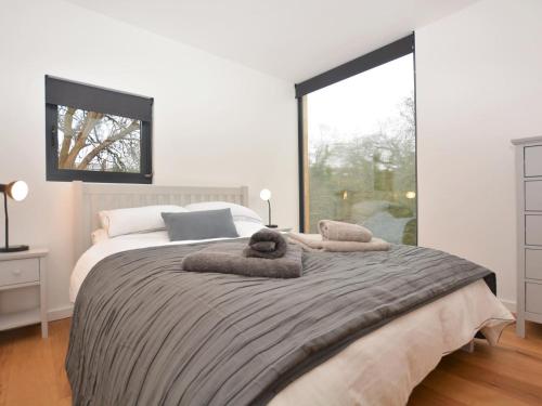 a bedroom with a large bed with towels on it at 2 Bed in Brecon oc-59733 in Talgarth