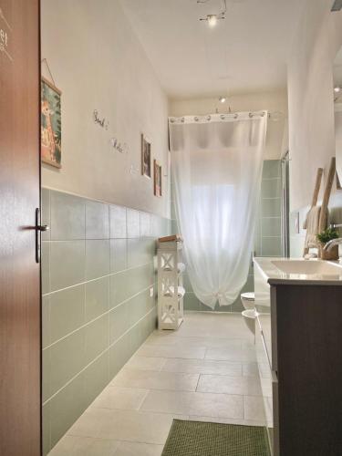 a bathroom with a shower and a toilet and a sink at A casa di Nonna Maria in Marsala