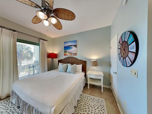a bedroom with a white bed and a window at Inn at Seacrest #203 - 30A Get-A-Way in Rosemary Beach