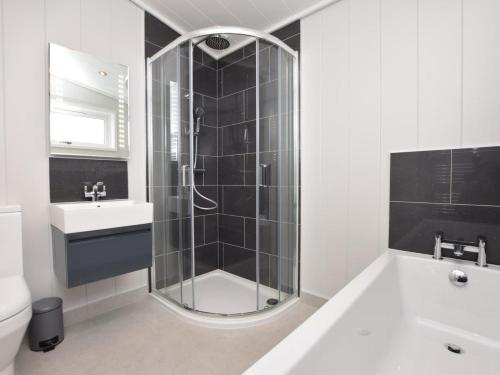 a bathroom with a shower and a sink at 2 Bed in Anstruther oc-72435 in Anstruther