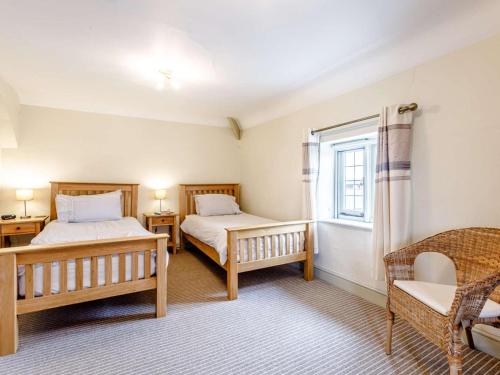 a bedroom with two beds and a window at 2 Bed in Taunton oc-blafa in Oake