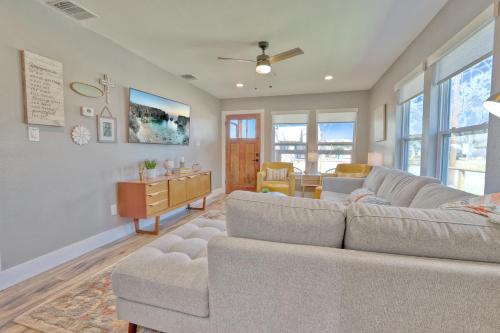 a living room with a couch and a table at Bridge Haus in New Braunfels