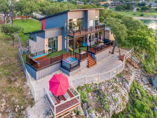 an aerial view of a house with an umbrella at Happy Owl Lakehouse in Canyon Lake