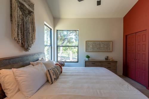 a bedroom with a large bed and a window at Happy Owl Lakehouse in Canyon Lake