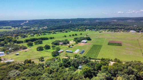 an aerial view of a field with farm equipment at D2 Farms in Wimberley