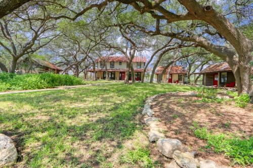 a house with a large yard with trees at D2 Farms Main House in Wimberley